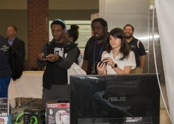 Attendees Playing a Throwback 8-bit Game